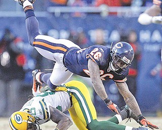 Green Bay Packers' Donald Driver is tackled by Chicago Bears' Tim Jennings (26) after catching a pass during the second half of the NFC Championship NFL football game Sunday, Jan. 23, 2011, in Chicago.