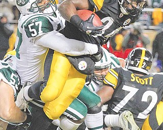 Pittsburgh Steelers running back Rashard Mendenhall (34) surges for a 1-yard touchdown in the grasp of New York Jets linebacker Bart Scott (57) during the first half of the AFC Championship NFL football game in Pittsburgh, Sunday, Jan. 23, 2011.