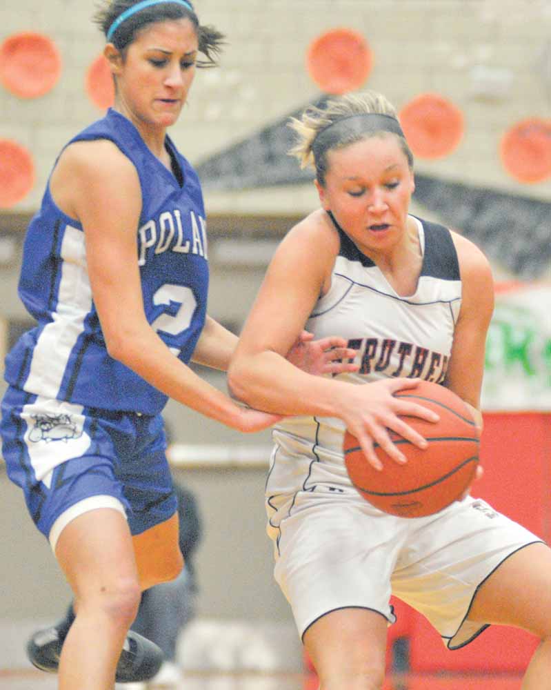 Poland's Kelsey Malenic (1) tries to get the ball from Struther' s (2) during their game at Struthers on Monday night. 