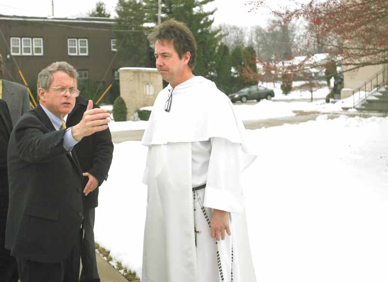 Ohio Attorney General Mike DeWine, left, met with the Rev. Greg Maturi at St. Dominic Church, 77 E. Lucius Ave., to discuss the crime problem in Youngstown. The attorney general was here Tuesday and said the process of reducing the city’s crime rate was ongoing. 