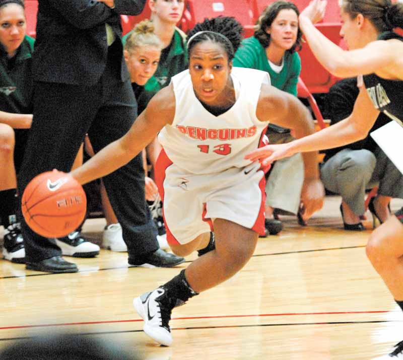 Closely guarded by Green Bay's Celeste Hoewisch, YSU's Macey Nortey drives to the basket. .