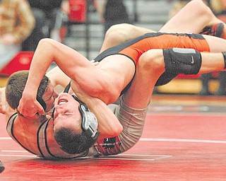 No. 3 in the state, Canfield's Robby Reed wrestles Howland's Gabe Stark at Canfield High School Wednesday evening. Reed won the 125 lb. division match.