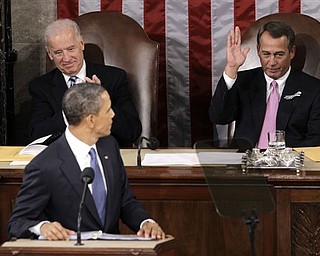 House Speaker John Boehner gestures after being acknowledged by President Barack Obama during his State of the Union address in Washington, Tuesday, Jan. 25, 2011. Vice President Joe Biden is at left.  (AP Photo/Charles Dharapak)