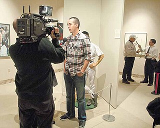 Pittsburgh Pirate Jeff Karstens (foreground) and pitching coach Ray Searage (background) are interviewed by members of the media yesterday afternoon at the Butler Institute for American Art.