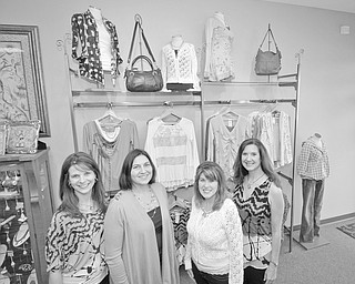 MARK STAHL | THE VINDICATOR: Displaying items they have chosen for the style show to be presented by La Ti Da Boutique at the Champagne Brunch and Fashion Show on Feb. 25 are, from left, Shelly Barton, Tammy Engle, Cassi Calderon and Susan Yarab, members of the Mahoning County Medical Society Alliance.