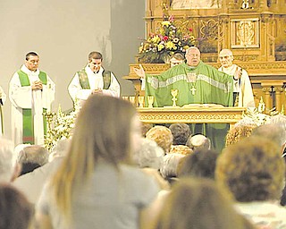 Bishop George V.  Murry delivers the final mass at Immaculate Conception Church in Youngstown.