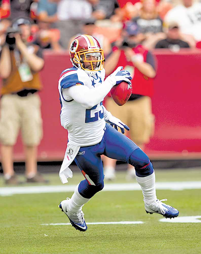 Washington Redskins cornerback DeAngelo Hall (23) runs after an interception during the first quarter of the NFL Pro Bowl  football game, Sunday, Jan. 30, 2011 in Honolulu. 
