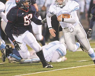 Hot Pursuit as Fitchs Steve Zaborsky (53) as he closes in on the Rebels QB Ray Russ (7) in the first round of playoffs.