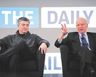 Rupert Murdoch, right, Chairman and CEO of News Corporation, and Eddy Cue, vice president of Apple, attend the launch of The Daily, Wednesday, Feb. 2, 2011 in New York. The Daily is the world's first iPad-only newspaper.