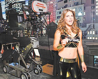 In this photo taken Monday, Dec. 6, 2010, GoDaddy.com Girl Jillian Michaels, Fitness trainer & "Biggest Loser" celebrity, is seen during the filming production of the 2010 Super Bowl television commercial for "GoDaddy.com" at the Delfino Studios in Sylmar, Calif. While the Super Bowl is the biggest gambling event of the year, for many advertisers, buying time in the game is a wager that almost always pays off.