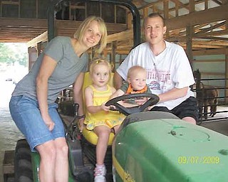 Cody Betts of Howland, diagnosed with a malignant brain tumor in 2008, is in California after receiving medical care. He is shown here with his wife, Jennifer, and their two children, Kylie, 4, and Cooper, 2.