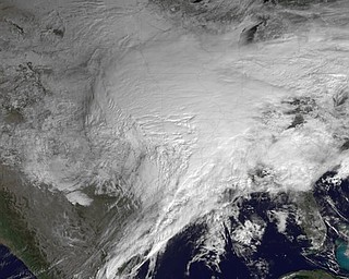 This satellite image provided by NOAA and taken Tuesday Feb. 1, 2011 at 10:45 EST shows a huge swath of the United States affected by a winter storm that has already brought layers of dangerous ice and blowing snow, closing roads and airports from Texas to Rhode Island. The storm's more than 2,000-mile reach threatened to leave about a third of the nation covered in a hodge-podge of harsh weather. Ice fell first and was expected to be followed by up to two feet of snow in some places. (AP Photo/NOAA)