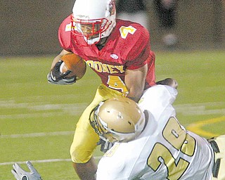 Warren Harding's Davion Rogers (29) is headed to YSU after singing with Michigan last February.