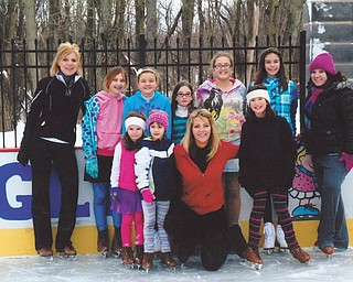 Recent skaters at the ice rink built by Rick and Laura Glass on their property in McDonald are, front from left, Maria, Gianna, Laura and Sophia, all of McDonald, and, back from left, Kim of Girard, Alesha and Bethany of McDonald, Chloe of Hartford, Olivia and Allison of McDonald and Kayla of Girard.