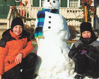Logan (10) and Ethan (7) Clark of Columbiana pose with their unnamed friend.