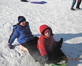 Matthew Ranno and his friend Nick LaPlante, both 8, of Poland find sled riding fun at Mill Creek Park.