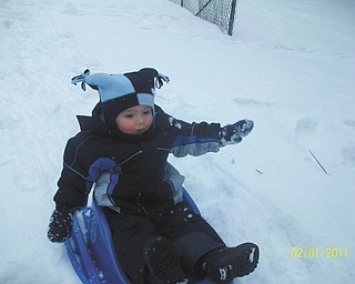 18-month-old Jimmy Putko from Boardman has a blast sledding for the very first time.
