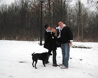 This photo sent in by proud mom Cathy Ferenchak of Canfield shows her children Kenny Ferenchak of Makaha, Hawaii, left, Angie Ferenchak of Westlake, Ohio, and John Bialowas, also of Westlake. In front is Cali, who also lives in Westlake and is "the most lovable dog in the world."