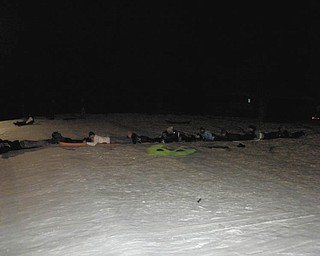 The grandchildren of Peggy Testa and the late Richard Testa of Struthers went sledding at Mill Creek Park during Christmas break. Shown here are Amanda, John and Amy Buntin of Franklin, Tenn.; Thomas, Anthony and Maria Fire of Poland; Katie Testa of Jacksonville, Fla., and Emily, Brennen and Andrew Testa of Poland. Not pictured were Christopher Fire and Meredith, Claire and Ana Testa.