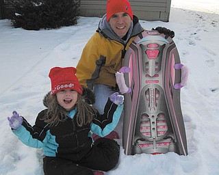 McKenna Sweeney, 6, has a blast with her dad, Michael, as they go sledding in his parents' back yard. Photo sent in by Marnee Sweeney.