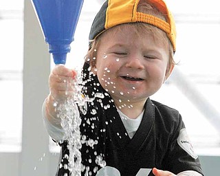 18 month-old Lucas Ahern, of Allison Park, Pa., plays at the water table in the Children's Museum of Pittsburgh as part of a kid's pep rally for the Pittsburgh Steelers, Saturday, Feb. 5, 2011 in Pittsburgh.