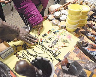 Shoppers examine merchandise for sale at the African Marketplace. Jewelry, clothes, books and art were among the offerings.