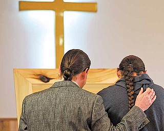 Bobby Tippi, left, and Bill Tippi, left, say their good byes to their mother, Betty Lou Davis, 79, of Athens County. She died last Saturday and the family had no money for her funeral. Friends built her a coffin, dug the grave, and had the funeral, Saturday, February 5, 2011.