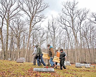 Friends and neighbors of Betty Lou Davis, 79, of Athens County carry her in a homemade coffin that they made a few days earlier to her final resting place at Stewart Cemetery. She died last Saturday and the family had no money for her funeral. Friends built her a coffin, dug the grave, and had the funeral, Saturday, February 5, 2011.