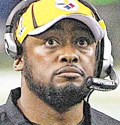 Pittsburgh Steelers head coach Mike Tomlin watches the scoreboard during the first half of NFL Super Bowl XLV football game against Green Bay Packers, Sunday, Feb. 6, 2011, in Arlington, Texas.