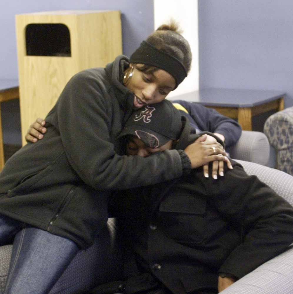 Tyler Thompson, one of the Youngstown State University students who was shot at a weekend party, gets a hug from fellow student Eve Griffins. Thompson wasn’t listed among the original list of those injured because he says he didn’t realize he’d been shot and sought medical attention on his own.