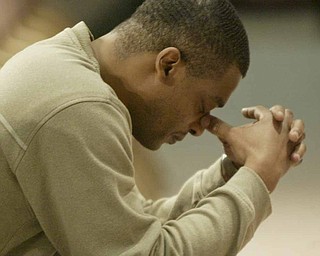 YSU student Darian Rich during a prayer service on campus Monday.