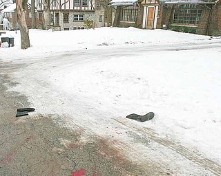 Boots, Jewelry and blood at the scene on Indiana Ave. Authorities in northeast Ohio say a shooting at a fraternity house just north of the Youngstown State University campus killed one student and injured 11 people, including six students.
