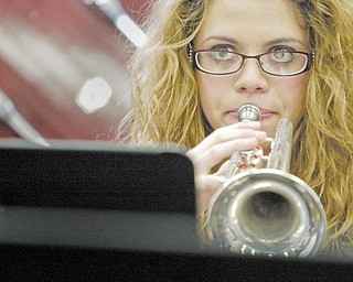 Boardman High School 12th grade band member Melanie D'eramo plays the trumpet during a practice. She is among 275 musicians in the Marching Band who have split up into other bands and ensembles for the winter season.