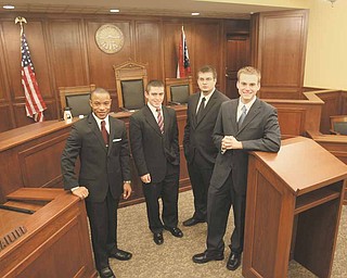 Members of Youngstown State University’s Moot Court Team, from left, James Toliver of Youngstown, a sophomore; and Mark Cornman, Travis Watson and Kevin Hulick, all juniors from Austintown; traveled to Tulane University in New Orleans last month to compete in the American Collegiate Moot Court Association’s national competition.