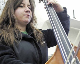 Boardman High School 10th grade band member Alyssa Vivacqua plays bass during a practice.