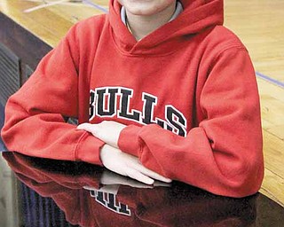 In this photo taken Jan. 11, 2011, Erik Yehl, 11, smiles in the auditorium of his school in Chicago. Yehl, who has been stuttering since preschool, said the film "The King's Speech", about a stuttering monarch, was sometimes tough to watch, because it hit so close to home. The award-winning film reveals myths and fascinating truths about stuttering, and has won praise from stutterers of all ages.