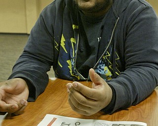 William D. Lewis the vindicator YSU student Dezmond Riley talkse about a shooting off campus. pixed on campus Monday 2-7-11