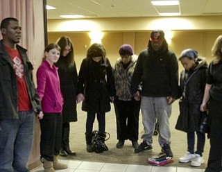 William D. Lewis the vindicator YSU students and facultyjoined hands during a Monday prayer service on campus for victims of a weekend shooting.