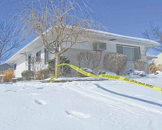 Investigators continued to work throughout the day Tuesday in this house at 138 S. Cleveland Avenue in Niles to uncover evidence of what caused the death of Lisa Fisher, 39. She was found dead on the
couch in the house on Monday afternoon, while her husband, John Fisher, 53, was found badly injured from apparent self-inflicted lacerations in a bedroom.