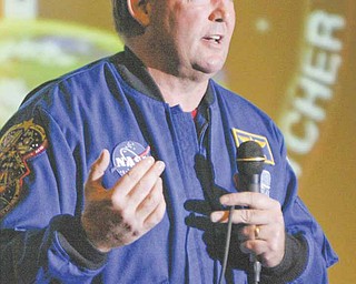 Astronaut Michael Foreman addresses 250 science teachers attending Trumbull County Educational Service Center’s professional development program Tuesday at Girard High School. Foreman shared insight into two space missions in which he logged more than 637 hours in space and five space walks. He also spoke to a group of Girard students.