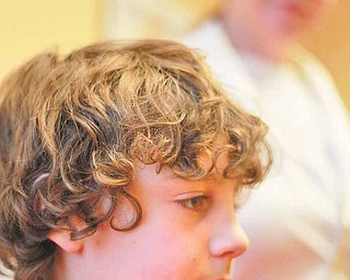 Sarah Casello-Rees, owner of The Lice Brigade and the boutique in Ann Arbor, Michigan, appears with her son, Donovan Rees, 7, who had lice for the first time in 2007. His lice prompted her to start her business one year later.