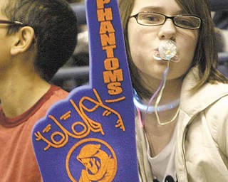 Irene Denney, a 6th grader from Niles, shows her team spirit during a Phantoms Hockey game Wednesday morning at the Covelli Center. The Phantoms took on the Indiana Ice in a 10 a.m. game with school children from the area attending.