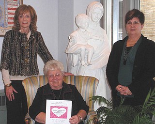 A special valentine event: A Valentine’s Day dinner and evening of entertainment have been planned for 6:30 p.m. Monday at the Ursuline Center, 4280 Shields Road in Canfield Township, as a benefit for the center. Pianist Thomas Solich will provide dinner music, and the Ursuline High School Chorus will entertain after the dinner. The gourmet meal will feature a Valentine theme and a chocolate fondue dessert. Standing, from left, Joan Sonnett and Becky Fisher approve the menu held by Sister Nancy Dawson, general superior for the Ursuline Sisters of Youngstown. Tickets cost $22 each or $200 for a table of 10. For tickets or additional information call the center at 330-799-4941.