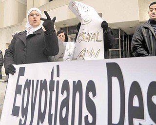 Amal Ilain of Youngstown was one of about 40 demonstrators who celebrated Egyptian President Hosni Mubarak’s resignation Friday in downtown Youngstown. The banner read, “Egyptians Deserve Democracy.”