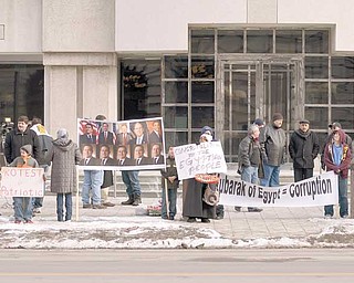 Demonstrators from the Arab American Cultural and Education Center gather at the Thomas Lambros Federal Courthouse in downtown Youngstown to celebrate Hosni Mubarak’s resignation as president of Egypt.