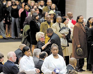 A fellow mourner comforts YSU's President Cynthia E. Anderson at the funeral of Jamail Johnson Saturday morning at YSU's Beeghly Center. Johnson, a YSU senior, was killed in a shooting early February 6th at his residence north of the YSU campus. 11 people, including six YSU students, were wounded.