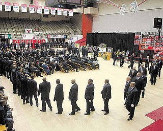 Members of the Omega Psi Phi fraternity gather during Jamail Johnson's calling hours Saturday morning at YSU's Beeghly Center.