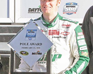 Jeff Gordon, left, and Dale Earnhardt Jr. hold their awards for winning the top two spots in qualifying for the NASCAR Daytona 500 auto race at Daytona International Speedway in Daytona Beach, Fla., Sunday, Feb. 13, 2011. Earnhardt won the pole position with a speed of 186.089 mph.