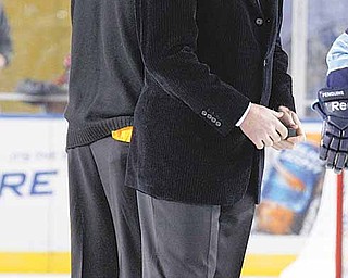 Pittsburgh Penguins co-owner and NHL Hall of Fame center Mario Lemieux, second from left, is joined by Pittsburgh Steelers Hall of Fame running back Franco Harris, left, and Sidney Crosby, right, for a ceremonial puck drop before the NHL Winter Classic outdoor hockey game against the Pittsburgh Penguins in Pittsburgh Saturday, Jan. 1, 2011. The Capitals won 3-1.