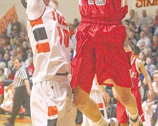 LaBrae's Peyton Aldridge (10) tries to score as Cody Dillon (10) plays tight defense during their game Tuesday evening.